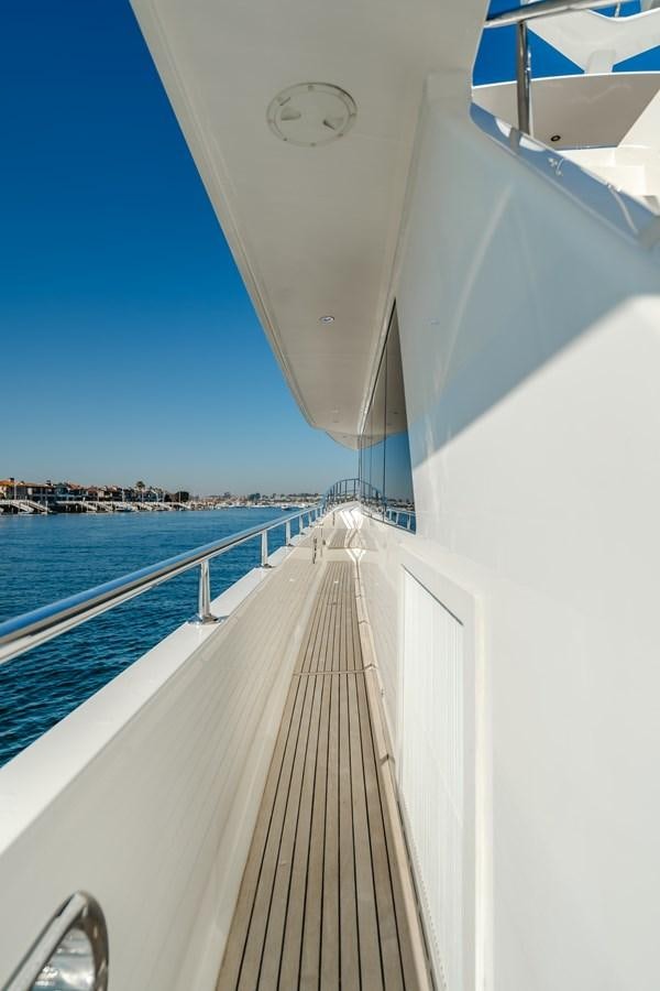 a white boat on a body of water aboard HAWK EYE  Yacht for Sale
