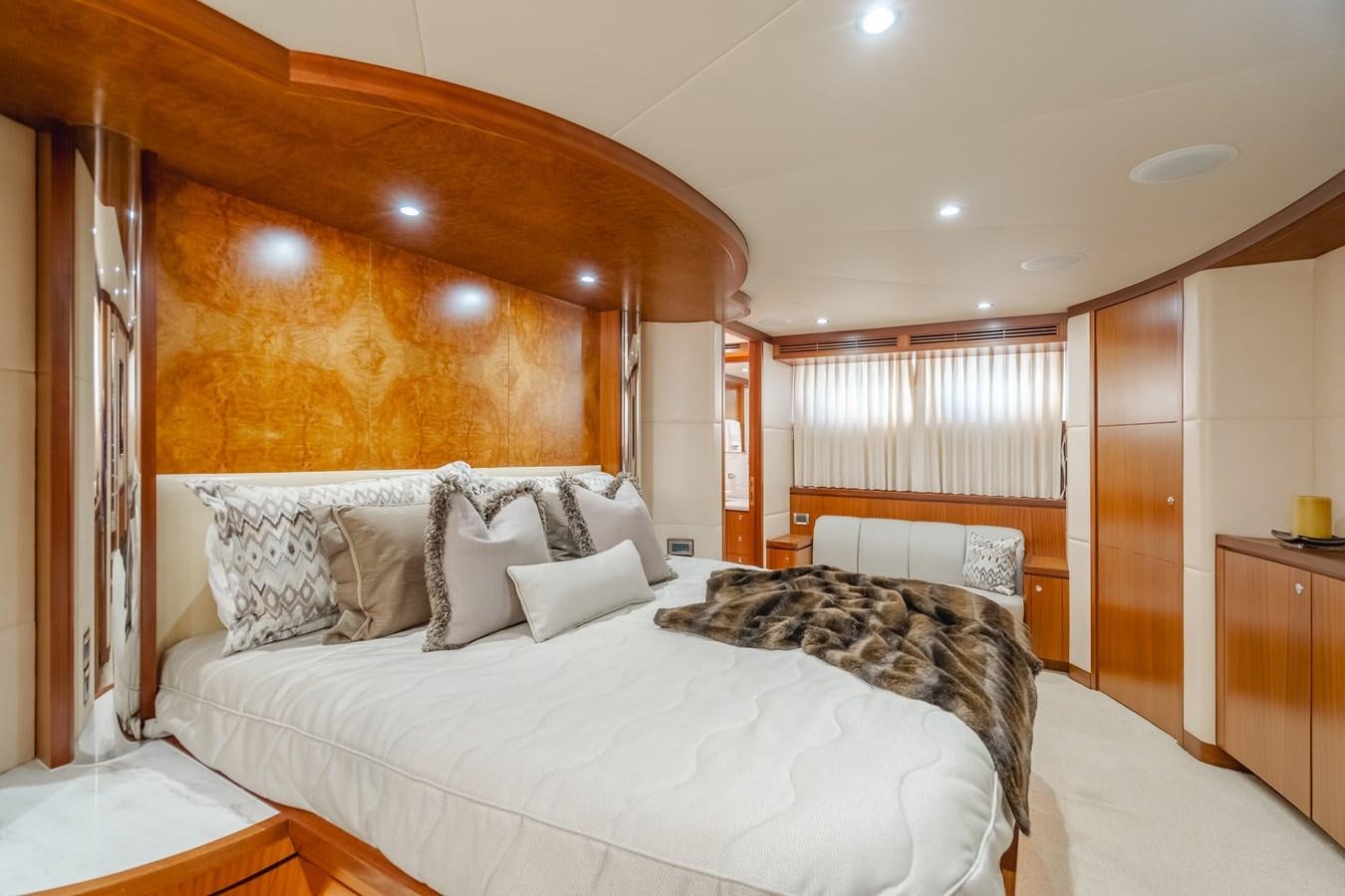 a room with a bed and a window aboard HAWK EYE  Yacht for Sale