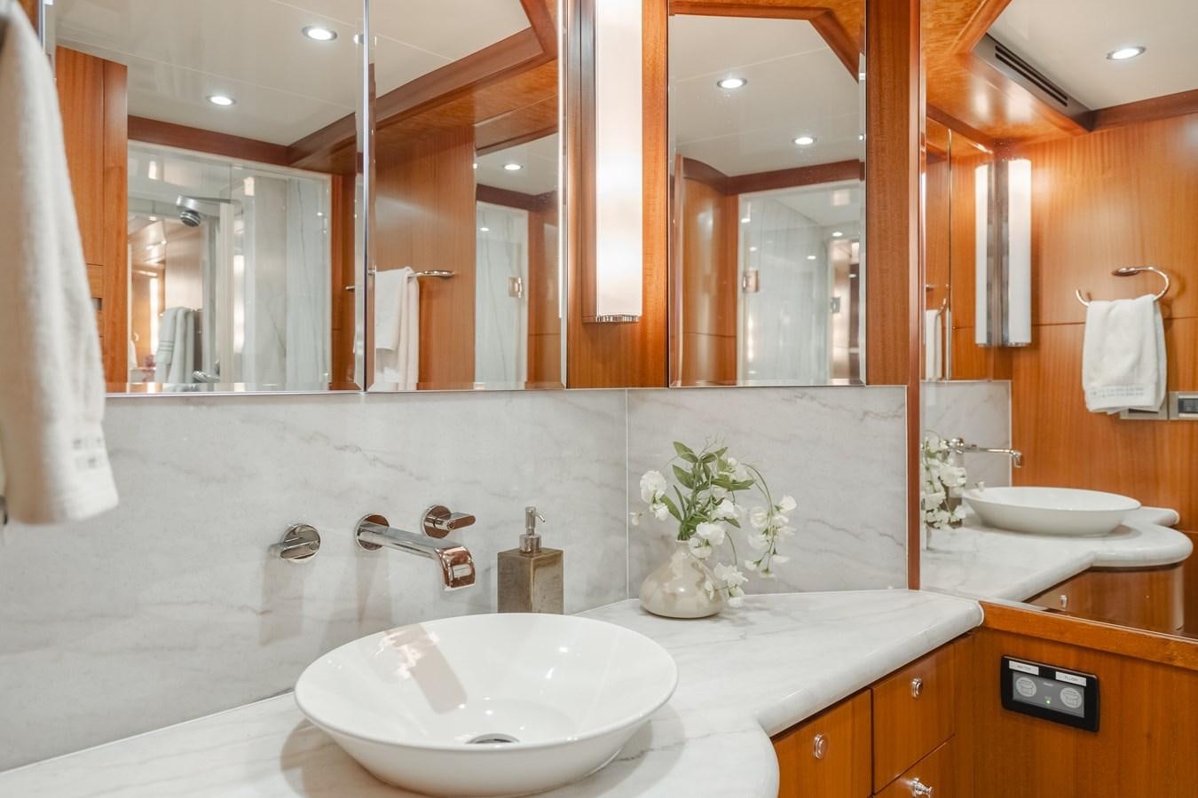 a bathroom with a large mirror aboard HAWK EYE  Yacht for Sale