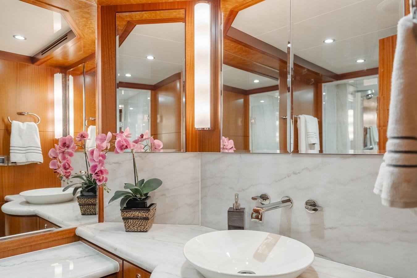 a bathroom with a large mirror aboard HAWK EYE  Yacht for Sale