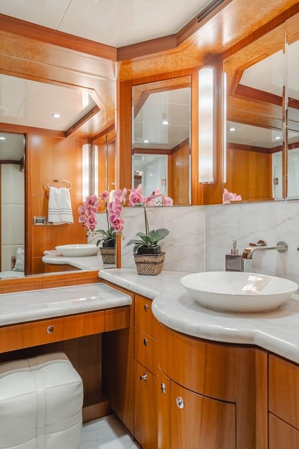 a bathroom with a sink and a mirror aboard HAWK EYE  Yacht for Sale