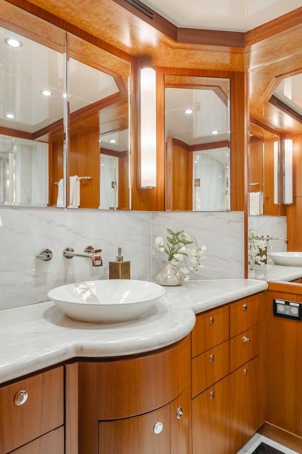 a bathroom with a sink and a mirror aboard HAWK EYE  Yacht for Sale