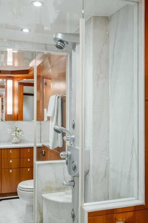 a bathroom with a shower curtain aboard HAWK EYE  Yacht for Sale