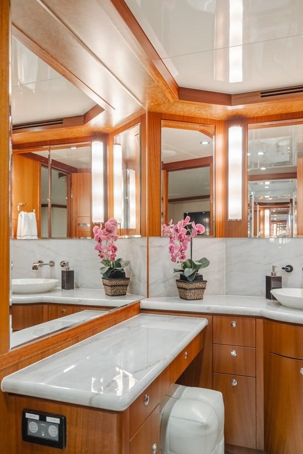a bathroom with a large mirror aboard HAWK EYE  Yacht for Sale