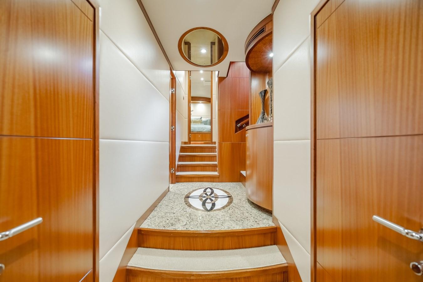 a bathroom with a round mirror aboard HAWK EYE  Yacht for Sale