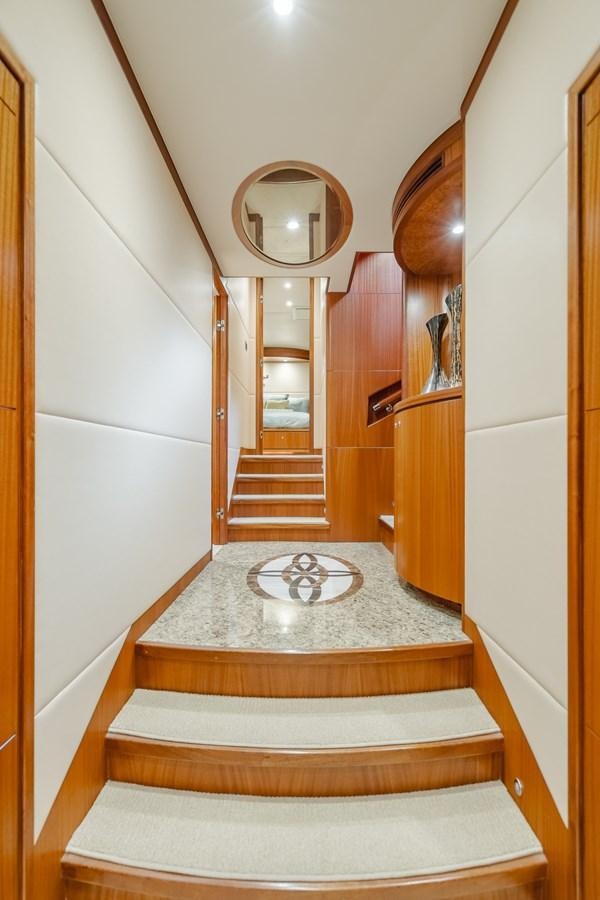 a bathroom with a round mirror aboard HAWK EYE  Yacht for Sale
