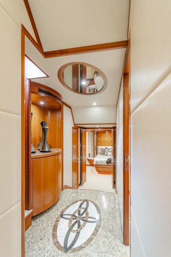 a bathroom with a round mirror aboard HAWK EYE  Yacht for Sale