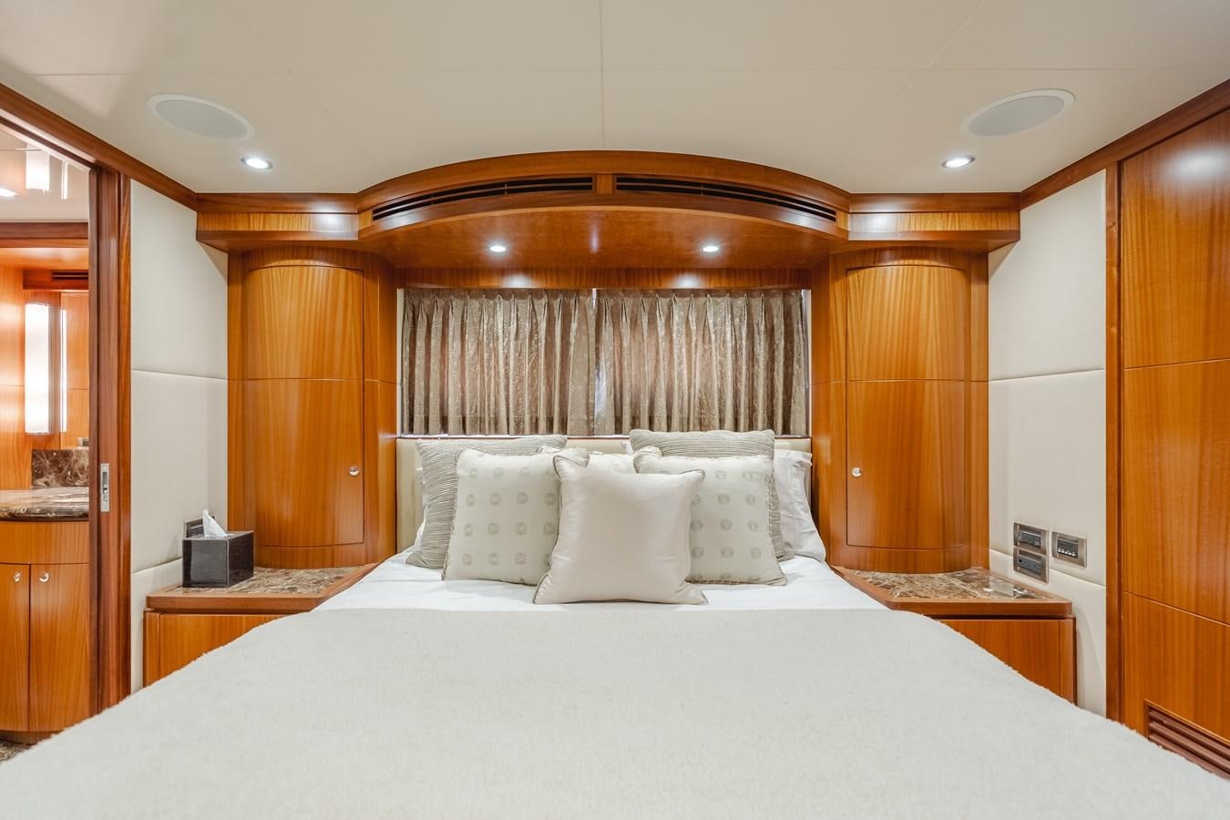 a bed with white sheets aboard HAWK EYE  Yacht for Sale