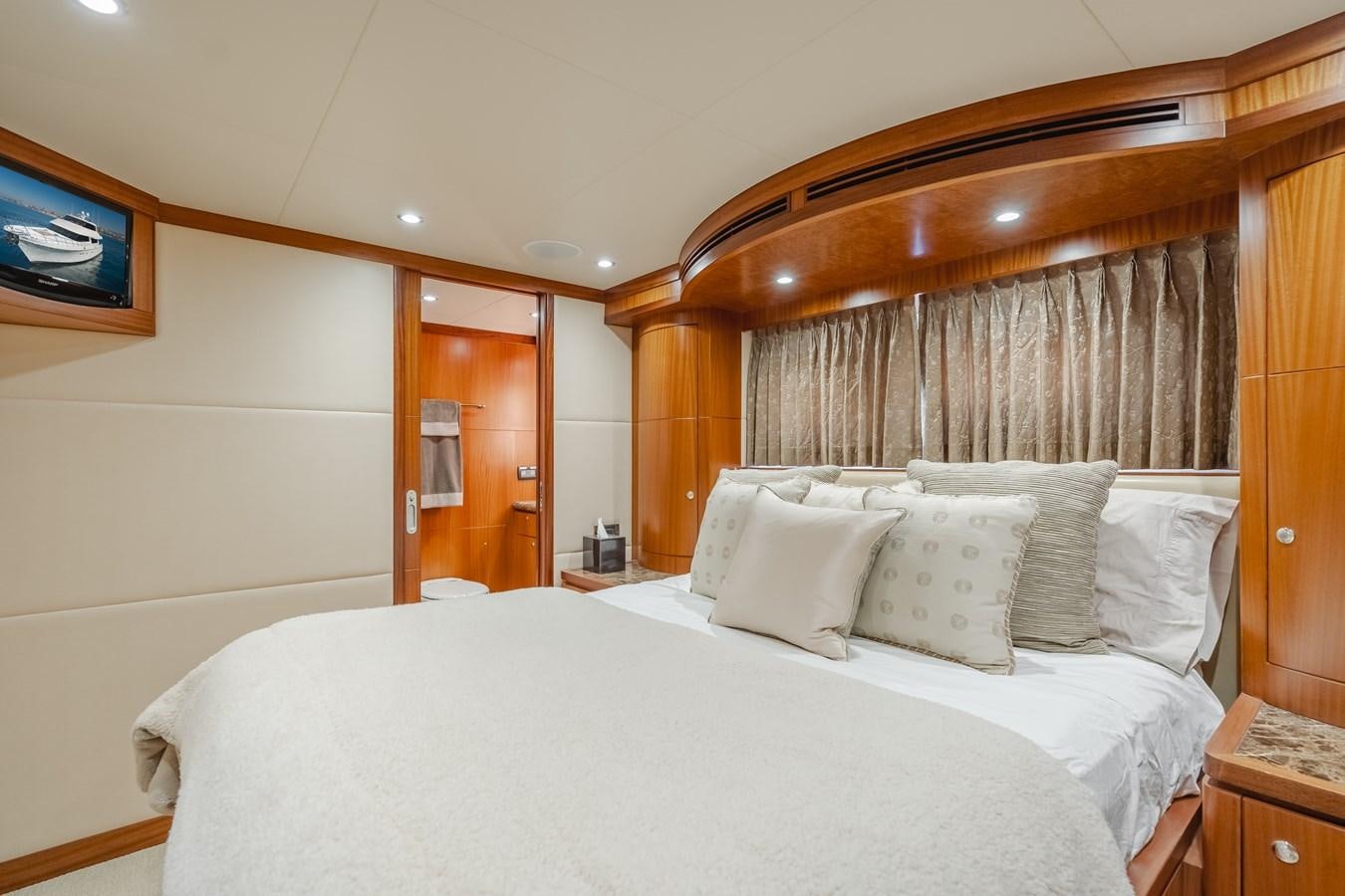 a bed with white sheets aboard HAWK EYE  Yacht for Sale