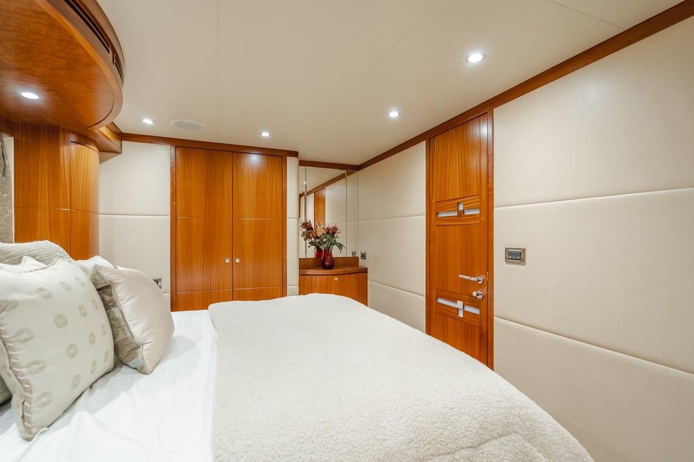 a room with a bed and a closet aboard HAWK EYE  Yacht for Sale