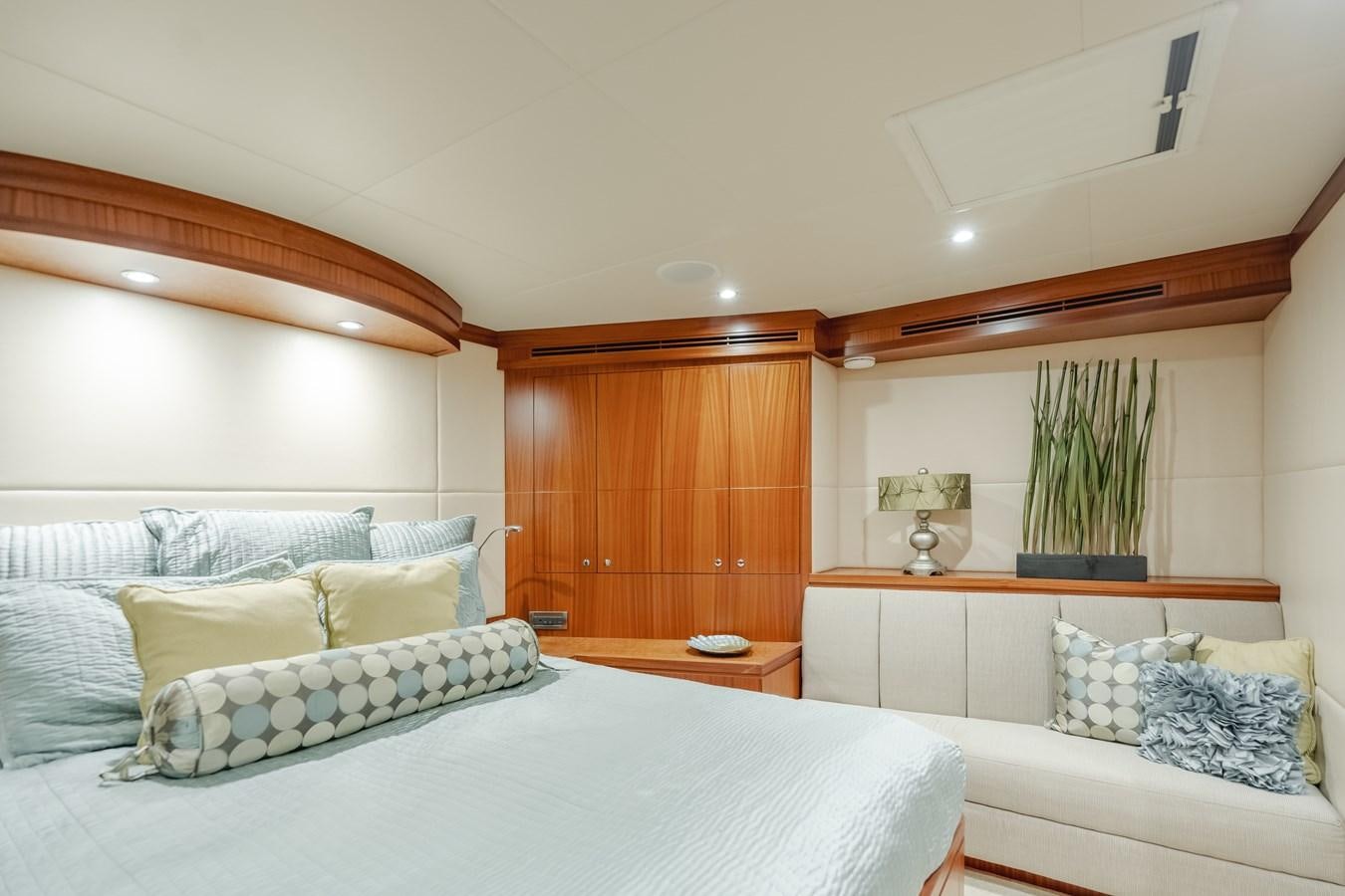 a room with a bed and a plant aboard HAWK EYE  Yacht for Sale