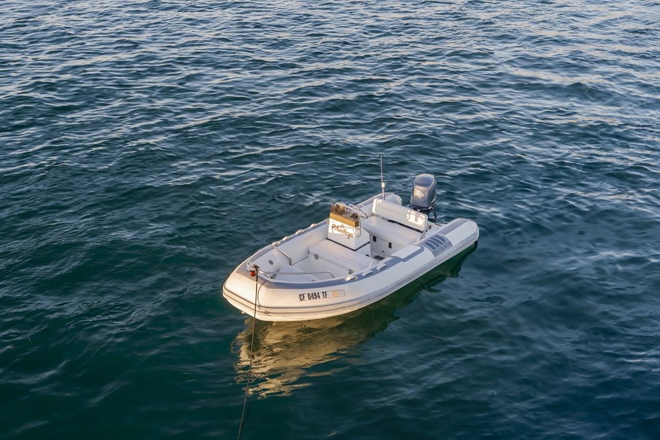 a small boat in the water aboard HAWK EYE  Yacht for Sale