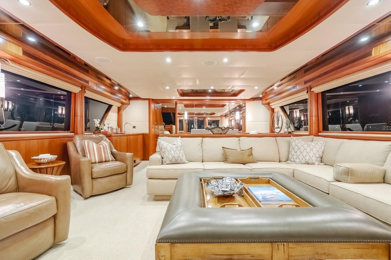 a living room with a large sofa aboard HAWK EYE  Yacht for Sale
