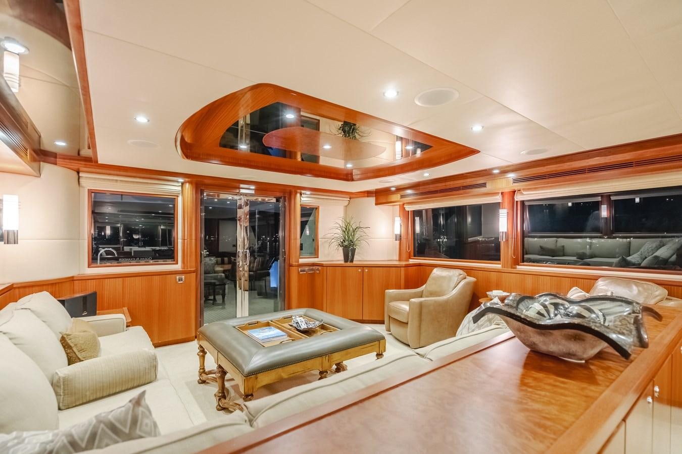 a living room with a large fireplace aboard HAWK EYE  Yacht for Sale