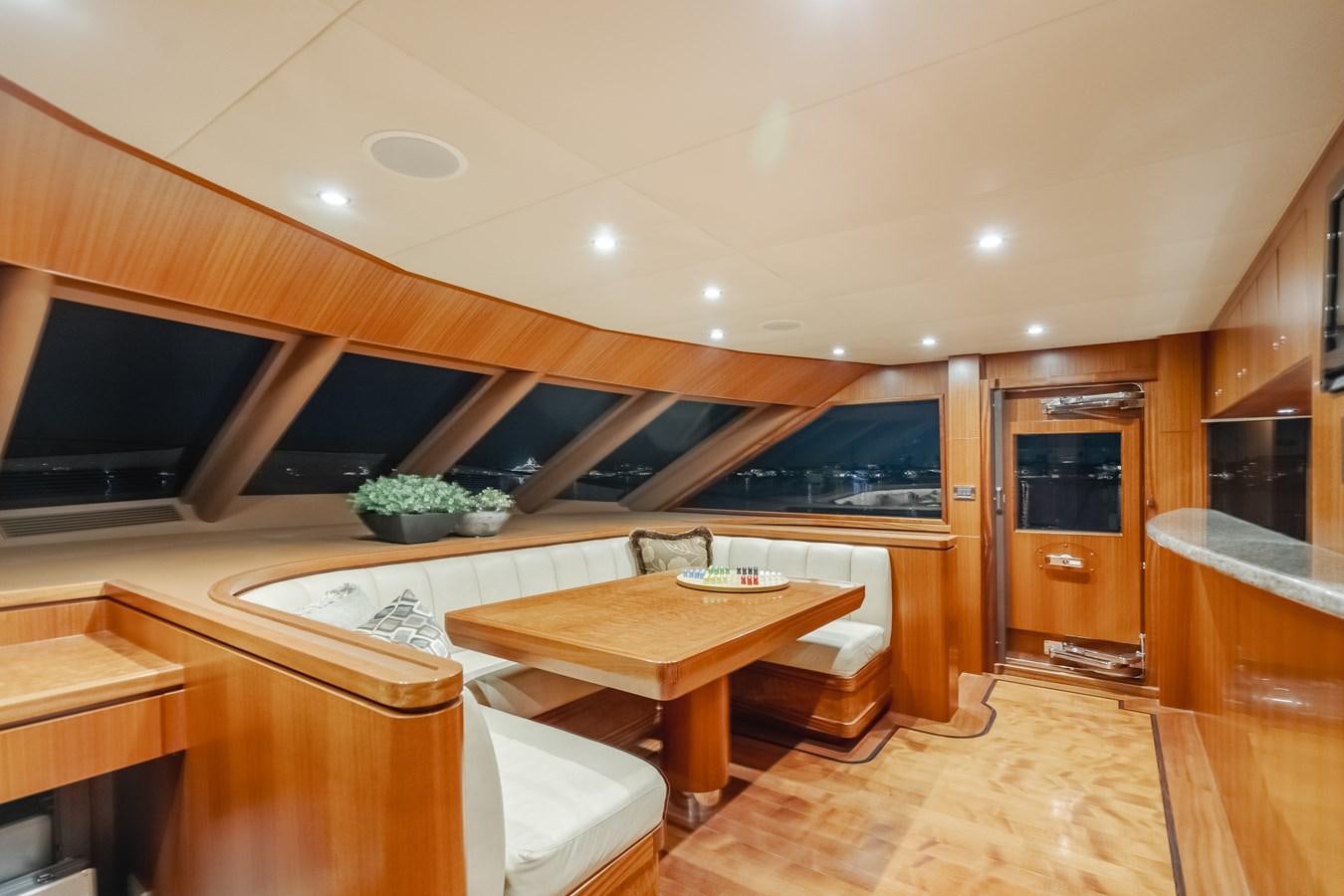 a room with a table and tv aboard HAWK EYE  Yacht for Sale