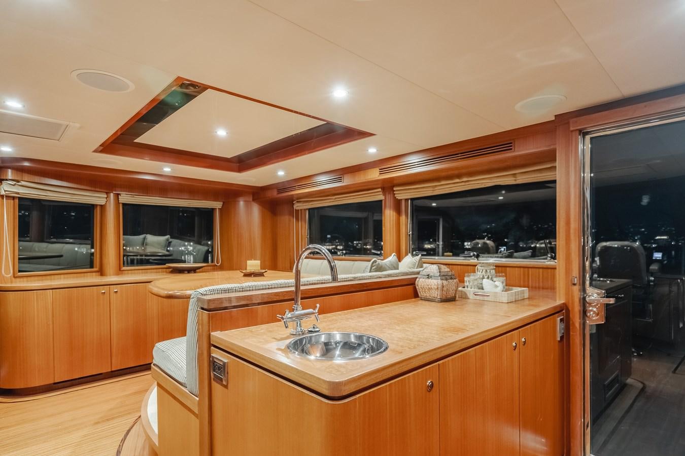 a kitchen with wooden cabinets aboard HAWK EYE  Yacht for Sale
