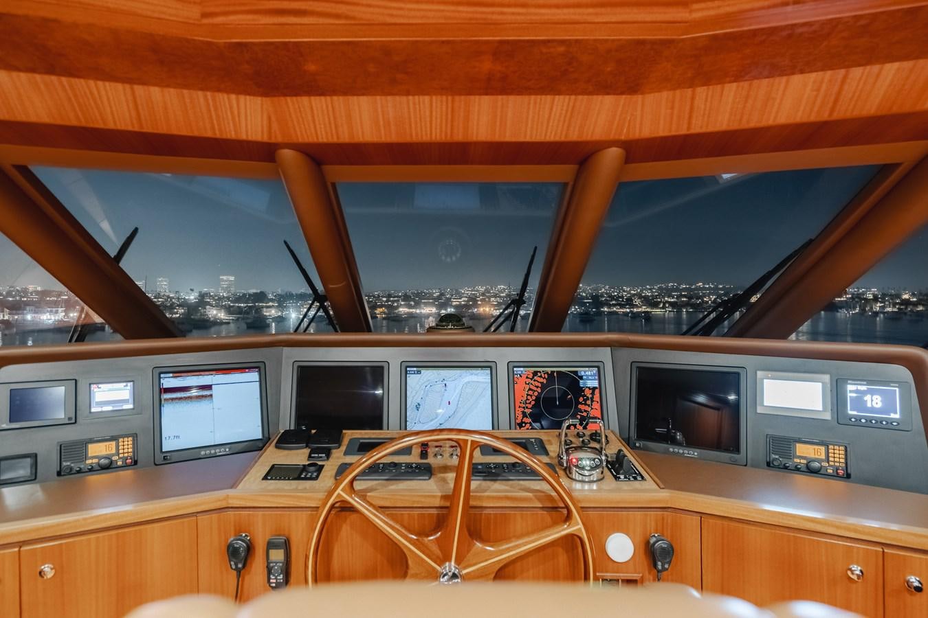 a wooden desk with computers and monitors aboard HAWK EYE  Yacht for Sale
