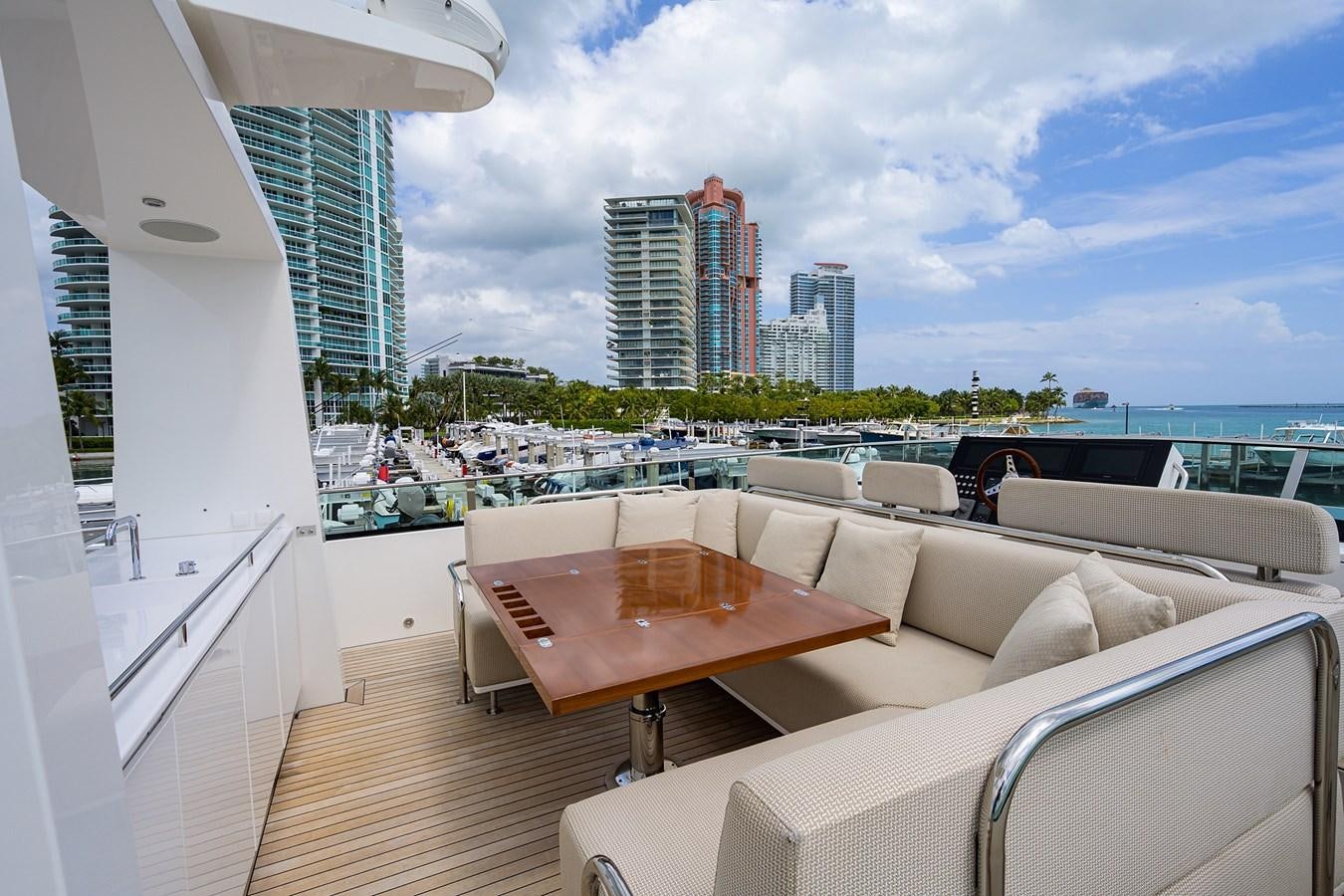 a room with a table and chairs aboard CHREEDO Yacht for Sale