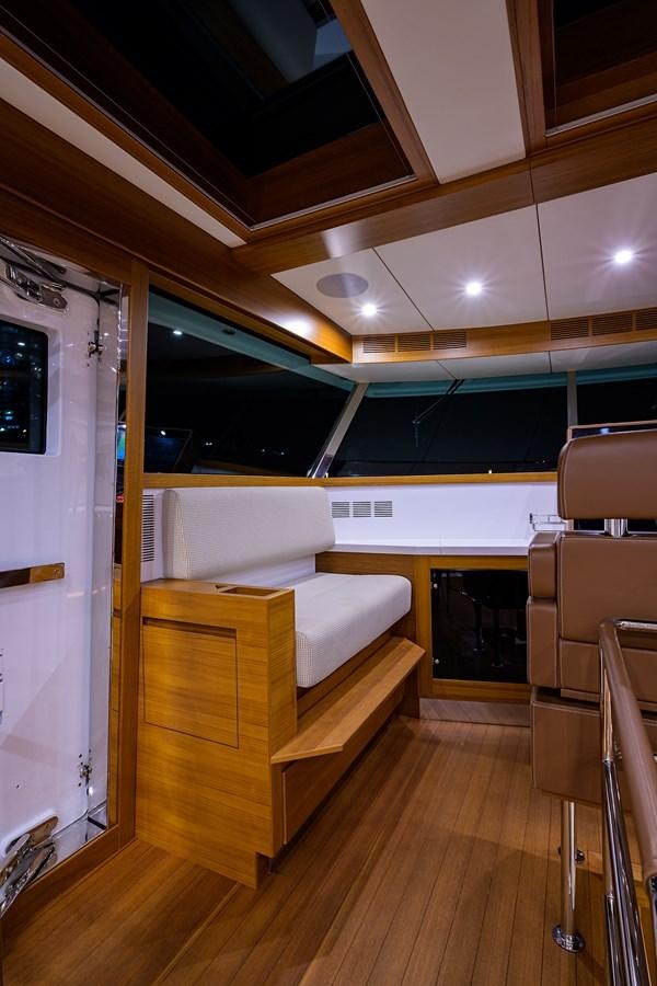 a room with a couch and a table aboard CHREEDO Yacht for Sale