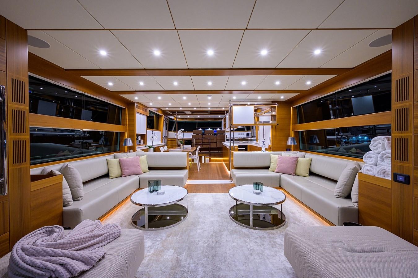 a living room with a large mirror aboard CHREEDO Yacht for Sale