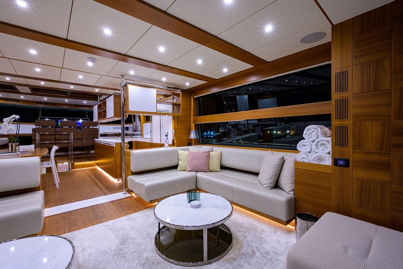 a living room with a couch and a table aboard CHREEDO Yacht for Sale