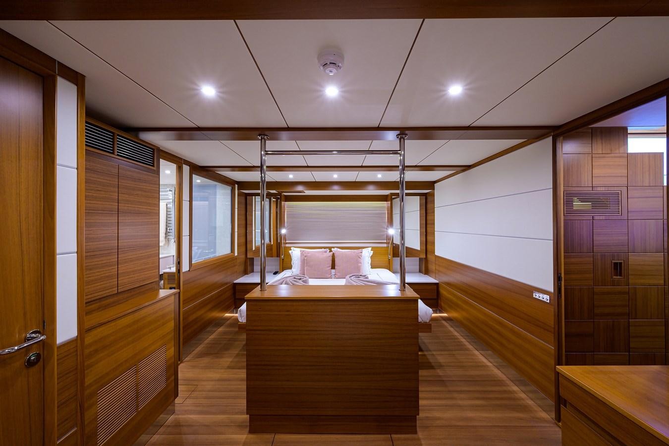 a room with wooden furniture aboard CHREEDO Yacht for Sale