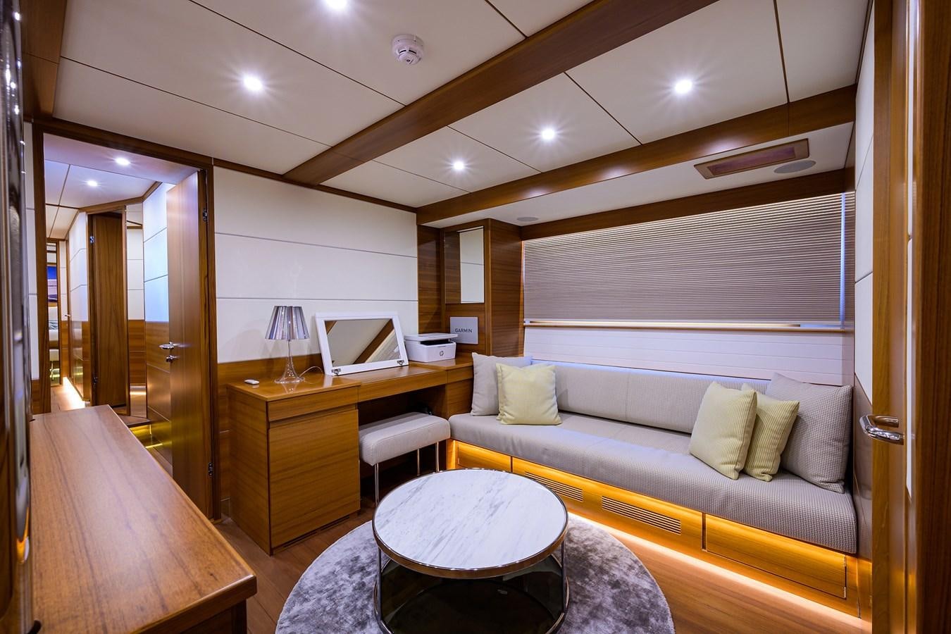 a living room with a couch and a table aboard CHREEDO Yacht for Sale