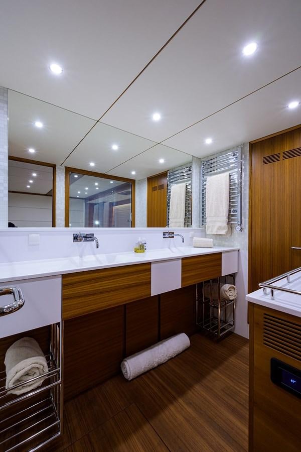 a bathroom with a large mirror aboard CHREEDO Yacht for Sale