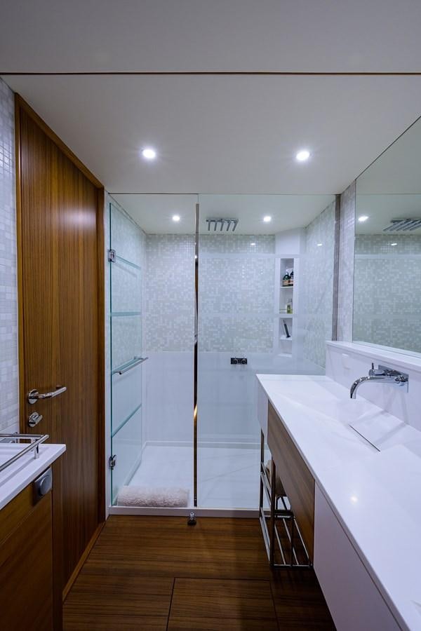 a bathroom with a shower and sink aboard CHREEDO Yacht for Sale