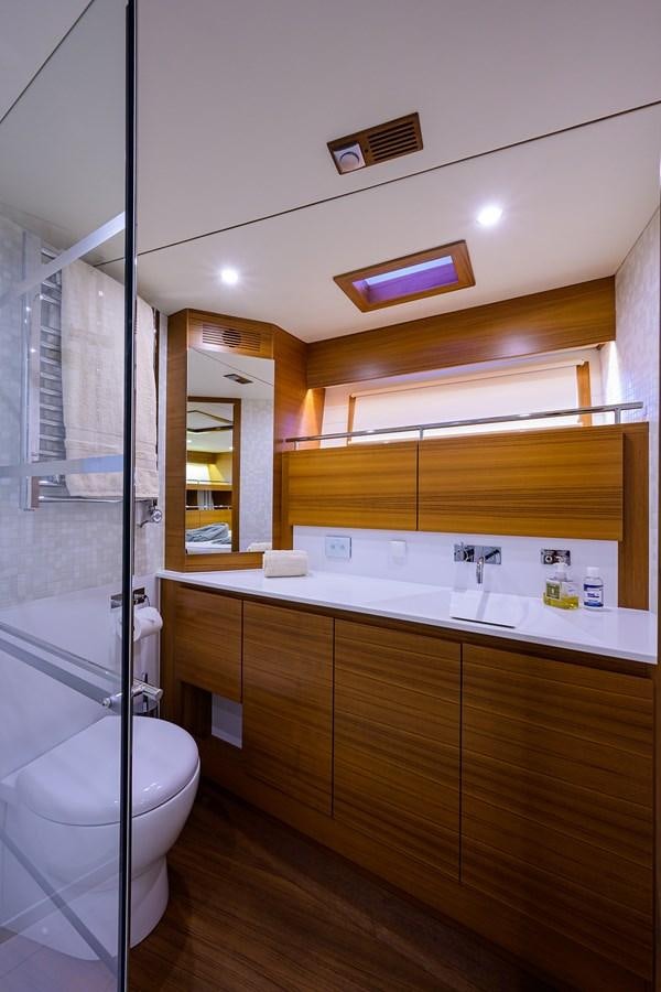 a bathroom with a glass shower aboard CHREEDO Yacht for Sale