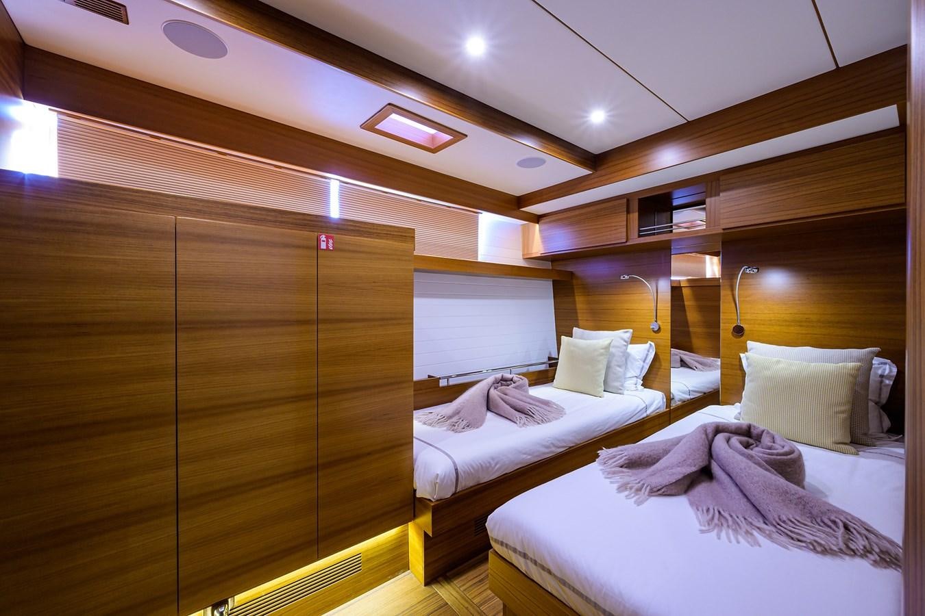 a room with a bed and a television aboard CHREEDO Yacht for Sale