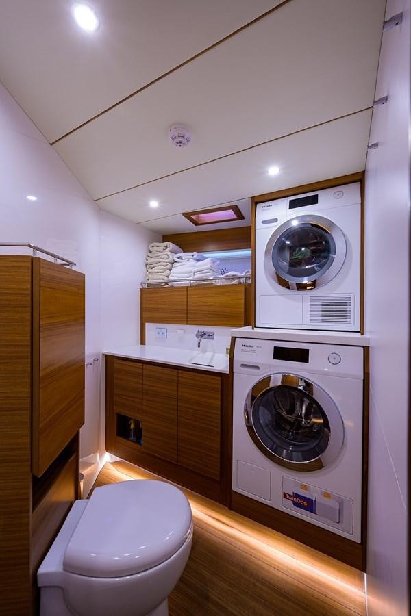 a washer and dryer in a bathroom aboard CHREEDO Yacht for Sale