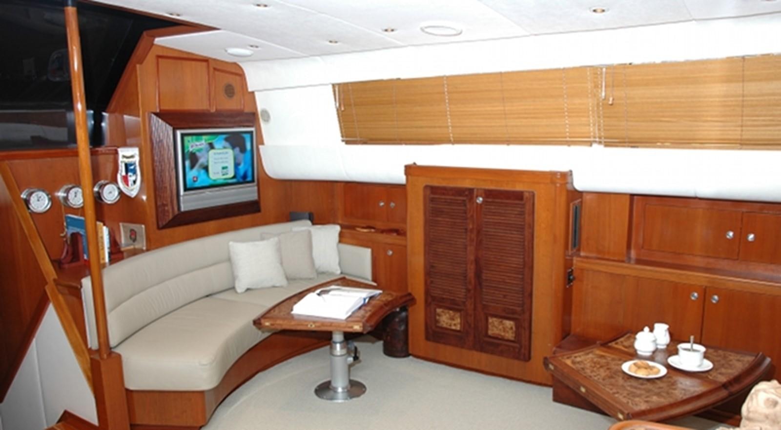 a living room with a couch and a table aboard SOUTHERN CROSS Yacht for Sale
