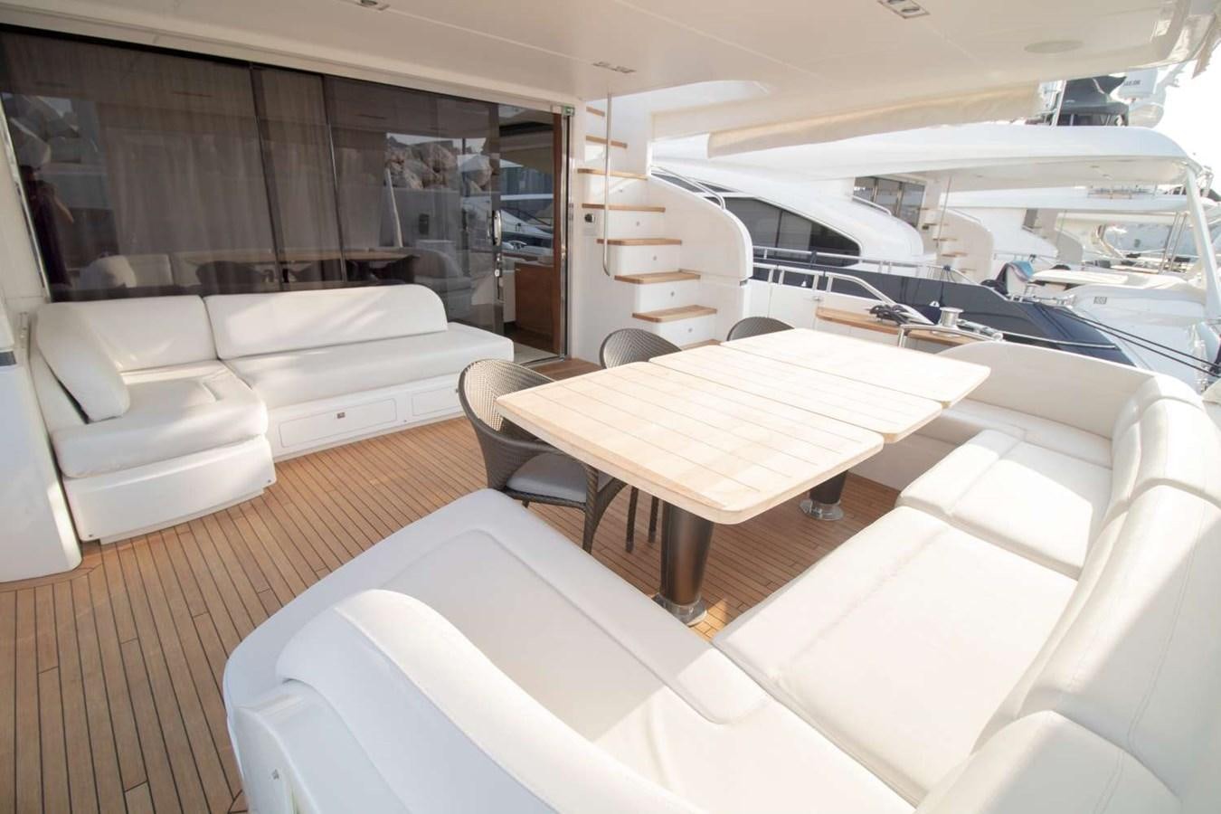 a room with a couch and a table aboard ALLURE Yacht for Sale