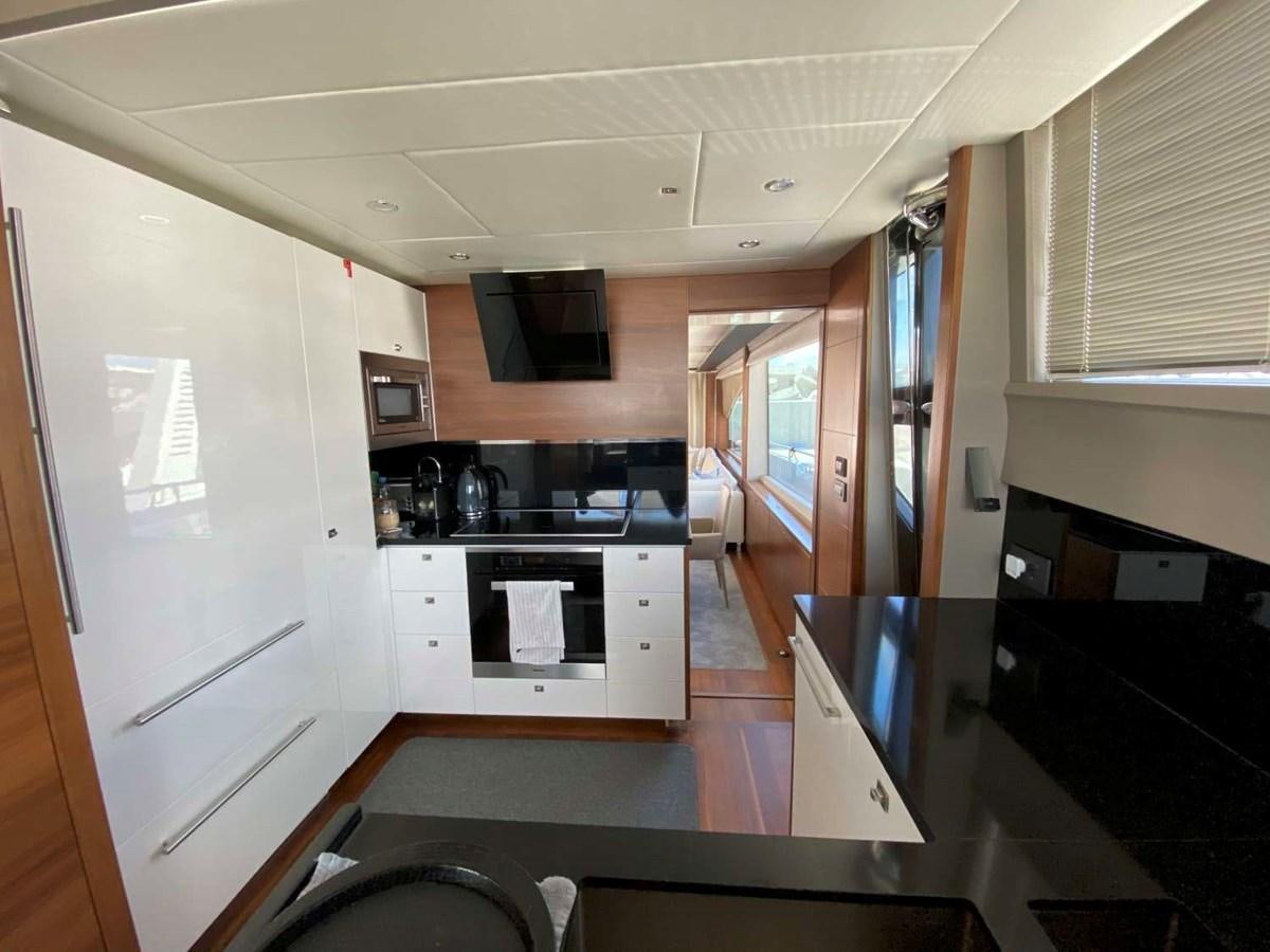 a kitchen with a black microwave aboard ALLURE Yacht for Sale