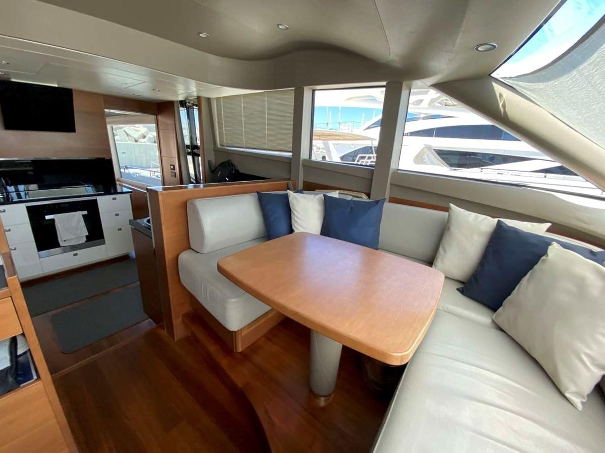 a room with a couch and a table aboard ALLURE Yacht for Sale