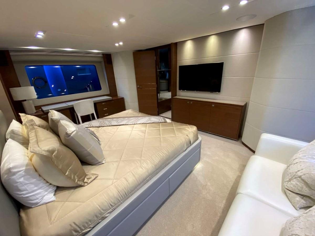 a hotel room with a bed and tv aboard ALLURE Yacht for Sale
