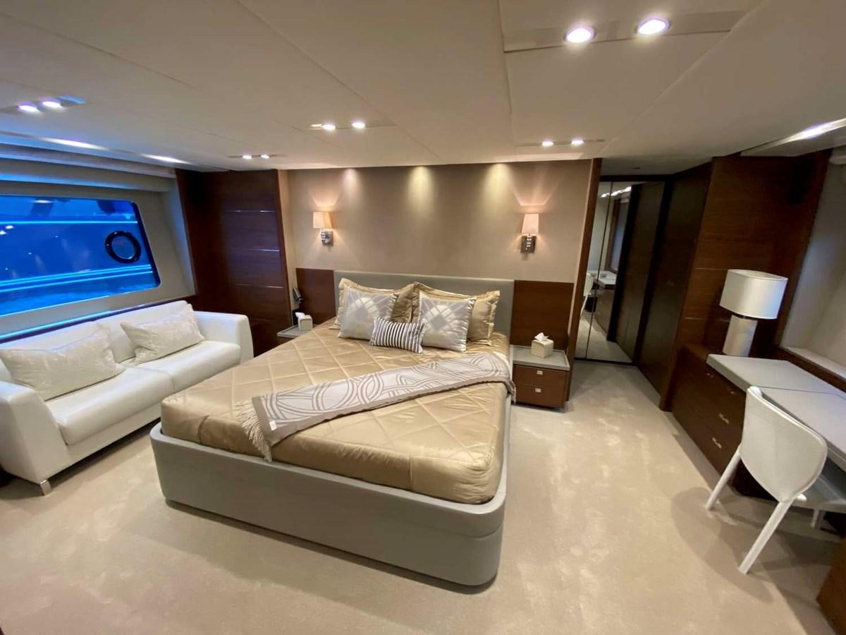 a living room with a couch and a window aboard ALLURE Yacht for Sale