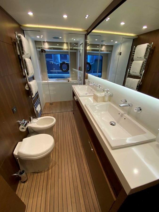 a bathroom with a large mirror aboard ALLURE Yacht for Sale
