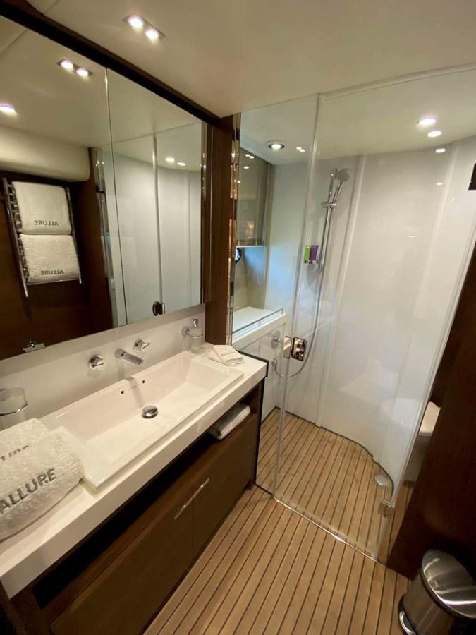 a bathroom with a large mirror aboard ALLURE Yacht for Sale