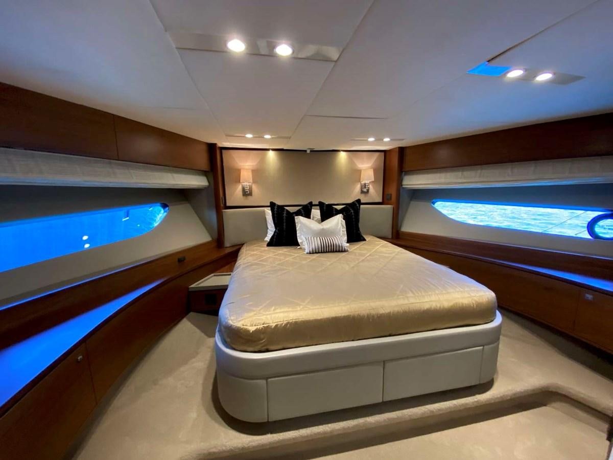 a room with a bed and a window aboard ALLURE Yacht for Sale