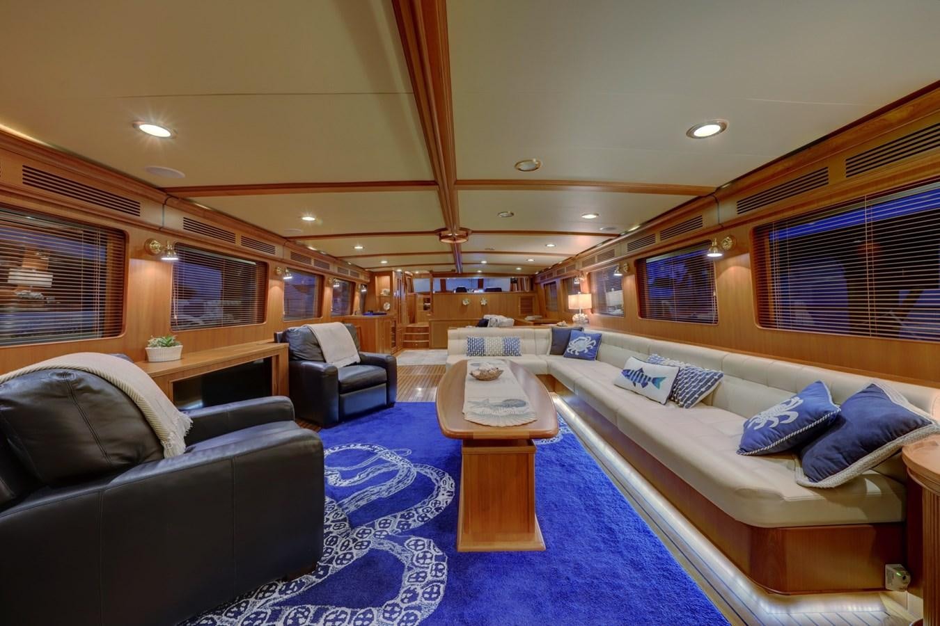 a large room with a bed and a table aboard ONE LIFE Yacht for Sale