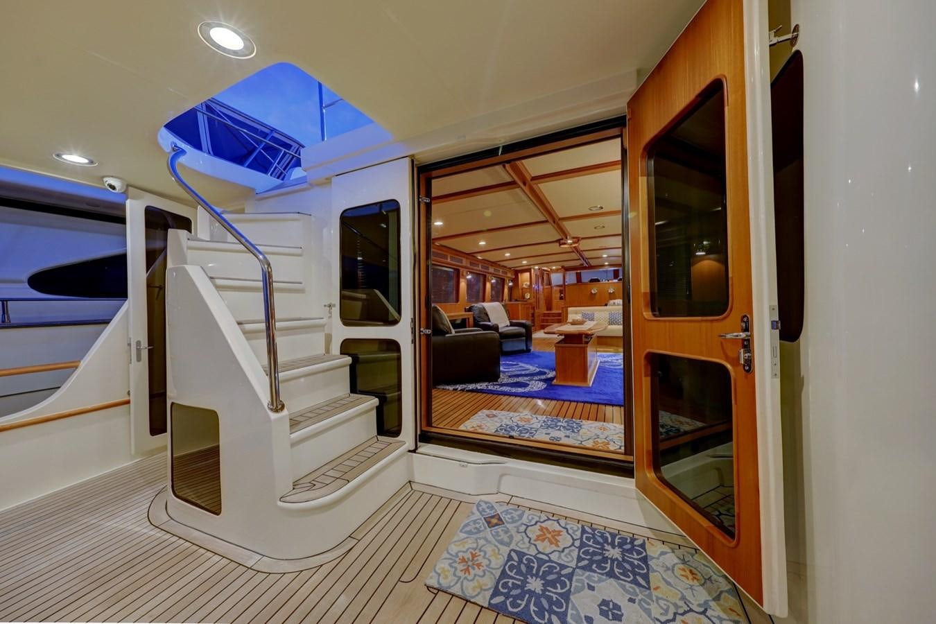 a hallway with a glass door aboard ONE LIFE Yacht for Sale