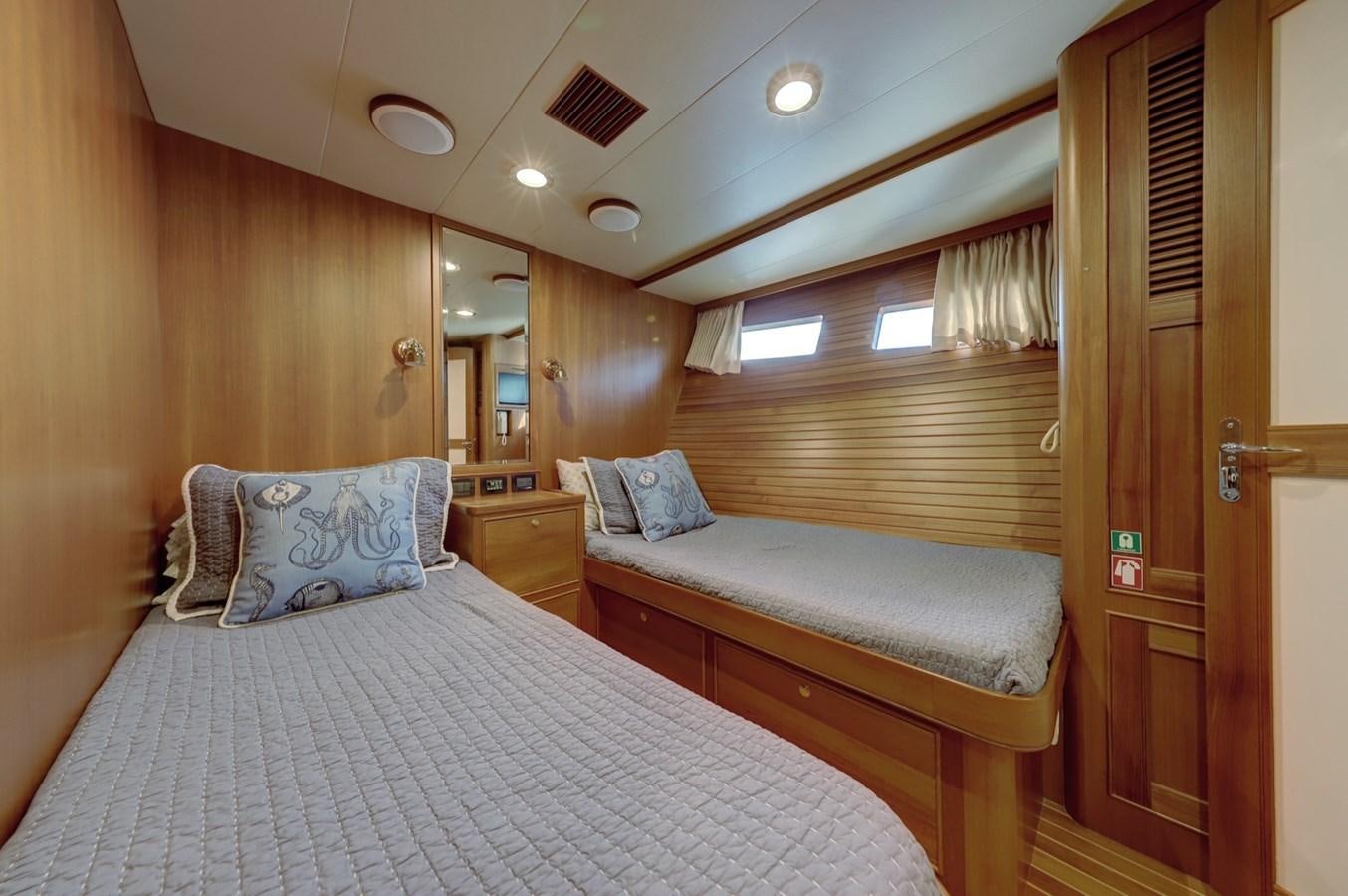 a bed in a room aboard ONE LIFE Yacht for Sale