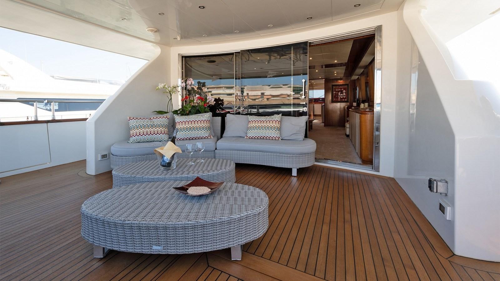 a living room with a couch and a table aboard FIRST LADY II Yacht for Sale