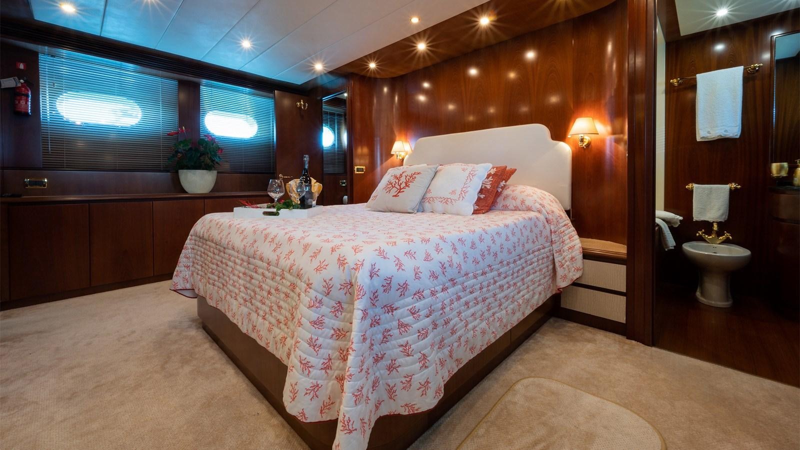 a large bedroom with a large bed aboard FIRST LADY II Yacht for Sale