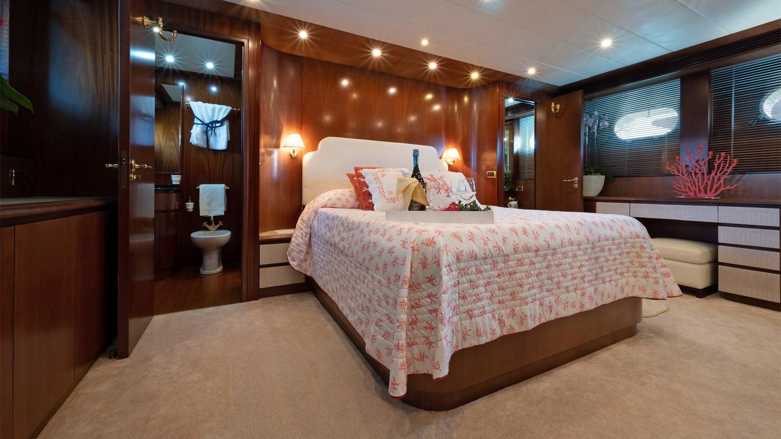 a large bed in a room aboard FIRST LADY II Yacht for Sale