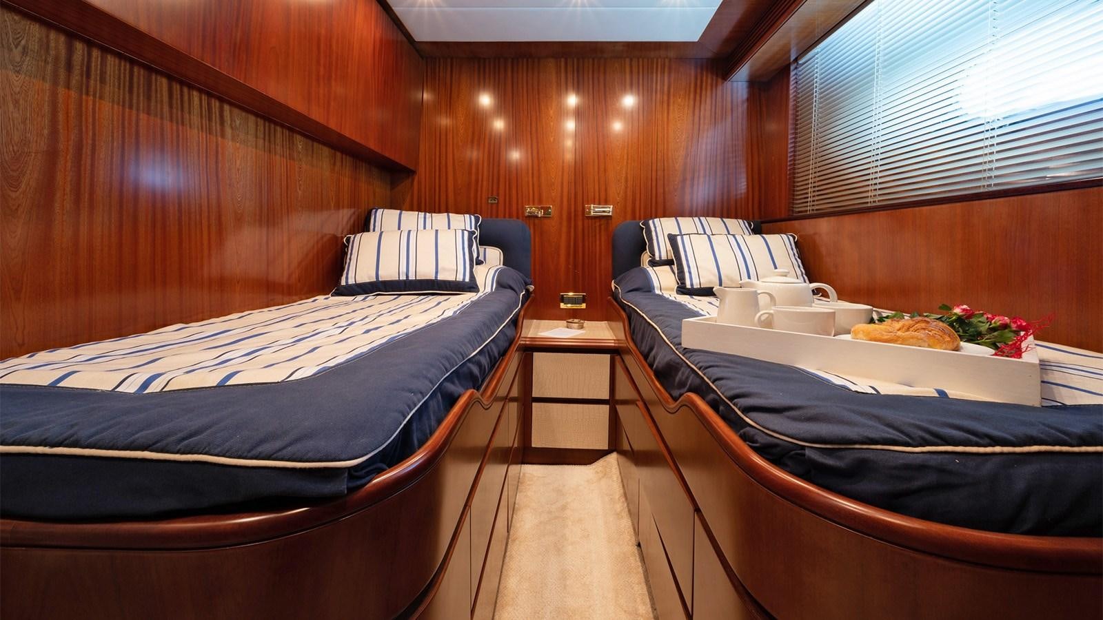 a room with two beds aboard FIRST LADY II Yacht for Sale