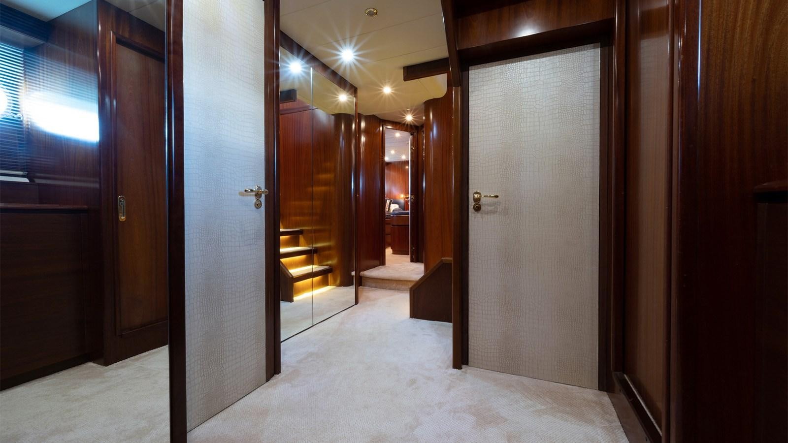 a hallway with doors aboard FIRST LADY II Yacht for Sale