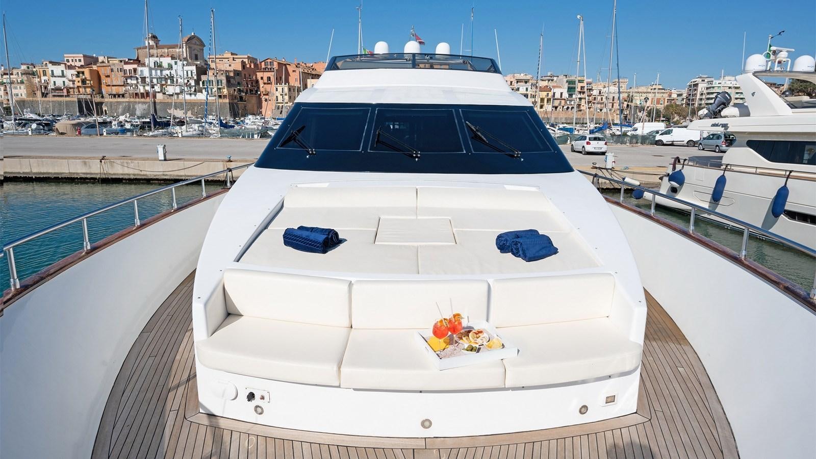 a white yacht in a harbor aboard FIRST LADY II Yacht for Sale